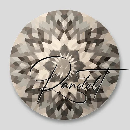 Circular geometric pattern with kaleidoscopic design in shades of gray and beige, featuring an overlaid stylized signature.