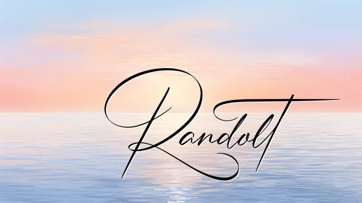 Cursive 'Randolt' over serene ocean at sunset, with pastel sky.