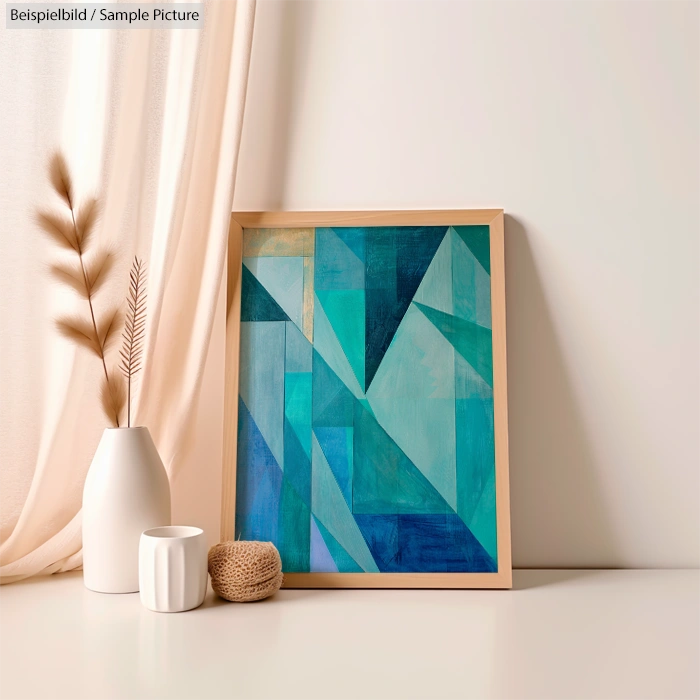 Geometric abstract painting in teal tones on easel near white vases and beige curtain.