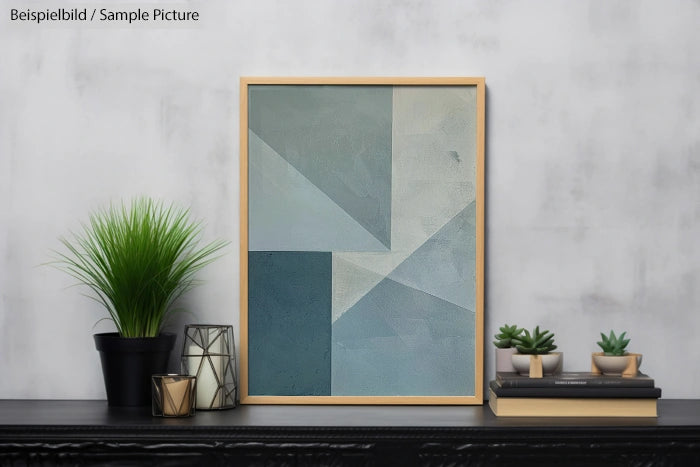 Geometric abstract painting in subtle blue tones on a shelf with plants and decorative items.