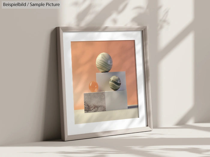 Framed artwork featuring geometric shapes with textured surfaces in pastel colors, casting soft shadows on the wall.