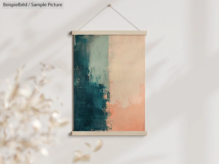 Abstract painting with teal and peach vertical halves in minimalist wooden frame, hanging on a light wall.