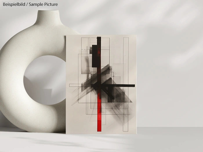 Abstract geometric art with black and red lines on a minimalist beige background, displayed next to a white sculpture.