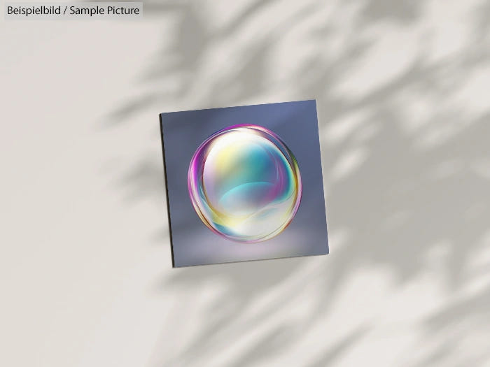 3D artwork of a colorful, translucent sphere on a tilted square background with shadows.