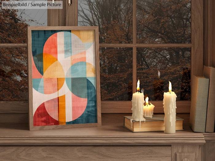 Abstract geometric art and candles on a wooden shelf in front of a window with autumn leaves view.