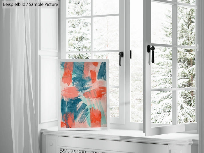 Abstract painting with coral and teal strokes on canvas, resting on a windowsill against a snowy outdoor backdrop.