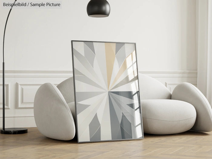 Modern living room with abstract geometric artwork and gray cushioned seating on wooden floor.