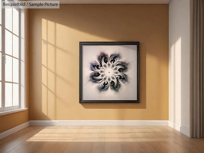 Contemporary art piece with swirling black and grey patterns on white, framed on a mustard yellow wall in a bright room.