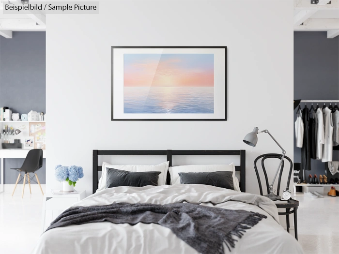 Modern bedroom with a large bed, lamp, and wardrobe. Wall art depicts a serene ocean view at sunset.