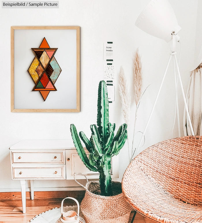 Bohemian-style room with wicker chair, tall cactus in basket, abstract geometric wall art, and white dresser.