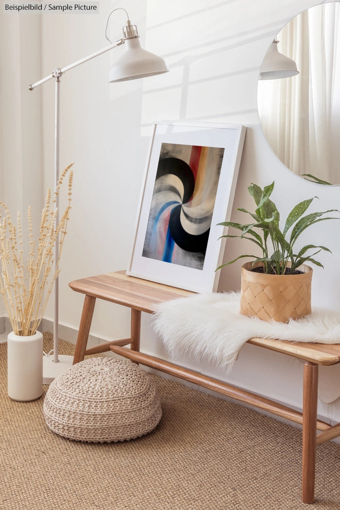 Modern room with abstract art, plant on a wooden bench, circular mirror, and floor lamp.