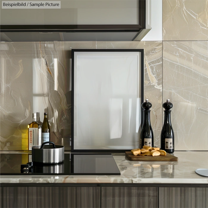 Modern kitchen counter with stove, olive oil bottles, and bread on a wooden platter; sleek marble backsplash.