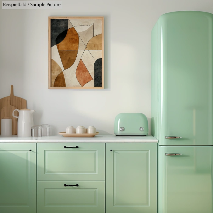 Mint green kitchen with retro fridge, abstract art, wooden chopping boards, and small mint green toaster.