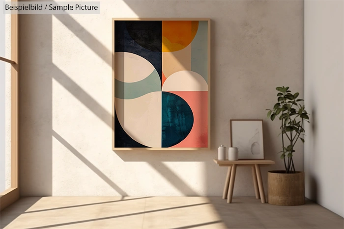 Modern interior with abstract geometric painting, small plant, and wooden table under soft sunlight.