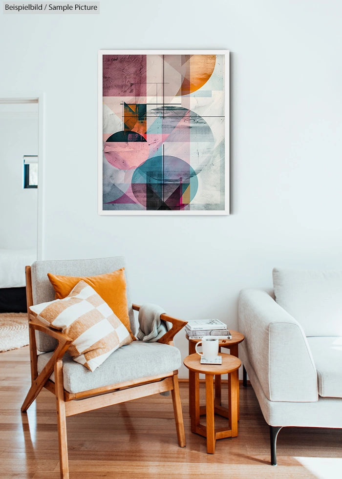 Modern living room with abstract geometric art, cozy chair, and small tables on wooden flooring.