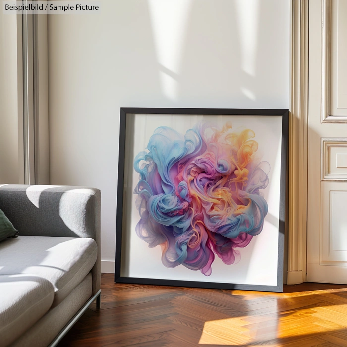 Framed abstract art with swirling pastel colors, placed on a wooden floor next to a sofa.