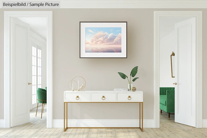 Minimalist room with a console table holding decor, framed cloud photo on wall, and armchairs in green alcoves.