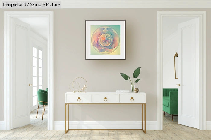 Minimalist living room with abstract art, white table, gold decor, and green chairs in a neutral-toned space.