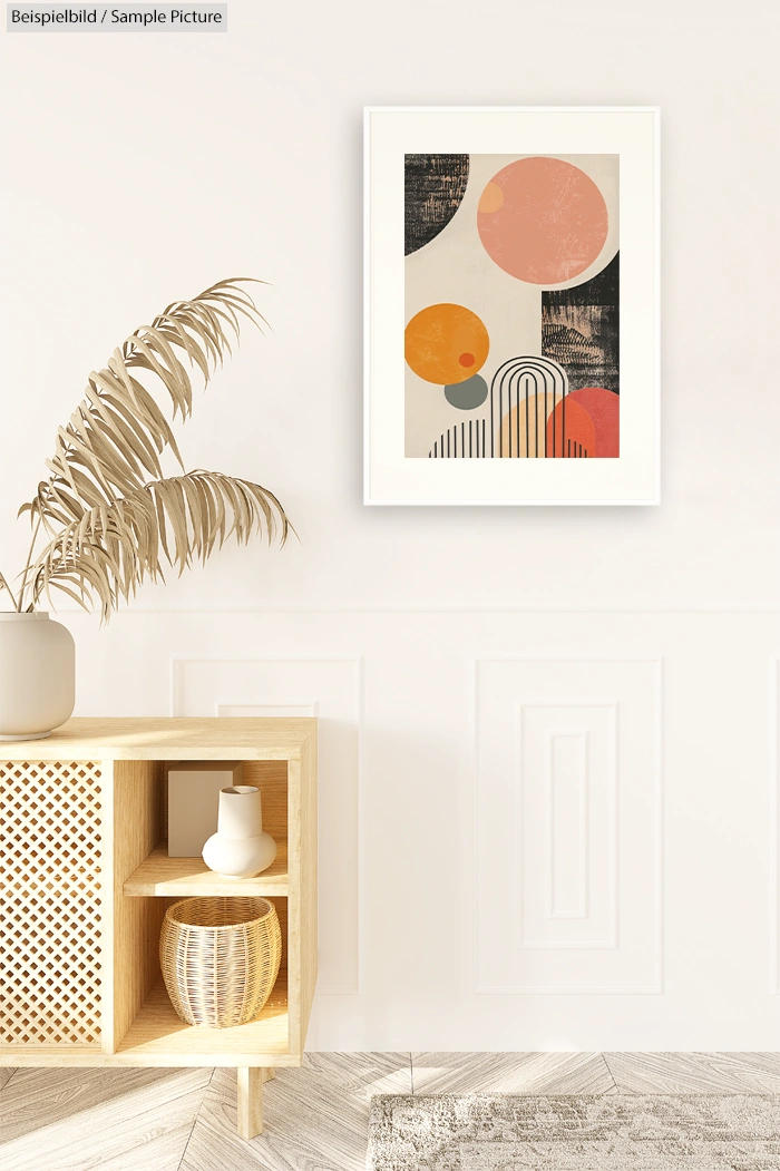 Modern living room with abstract art, neutral tones, and wooden cabinet displaying decorative items and potted plant.