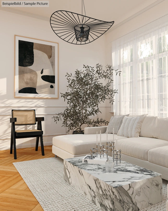 Modern living room with abstract art, white sofa, marble coffee table, and decorative plant.