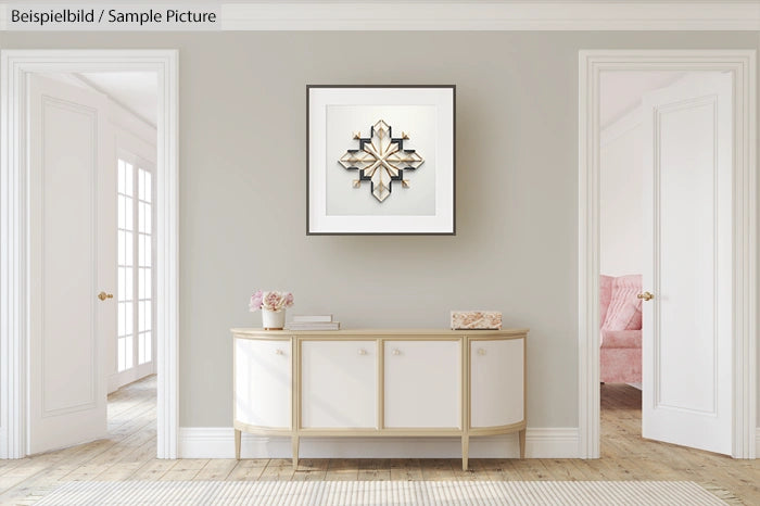 Minimalist interior with a console table, decorative frame, and soft pink armchair visible through open doorways.