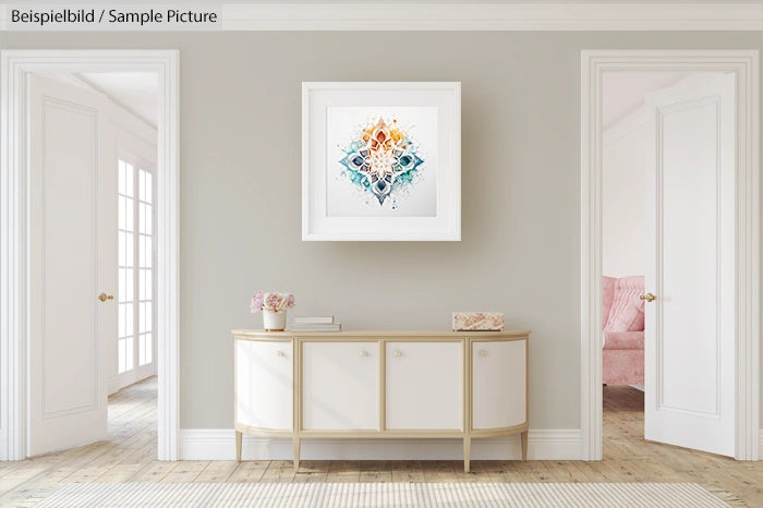 Elegant hallway with a sideboard, abstract art on wall, and doorways leading to a bright room with cozy pink seating.