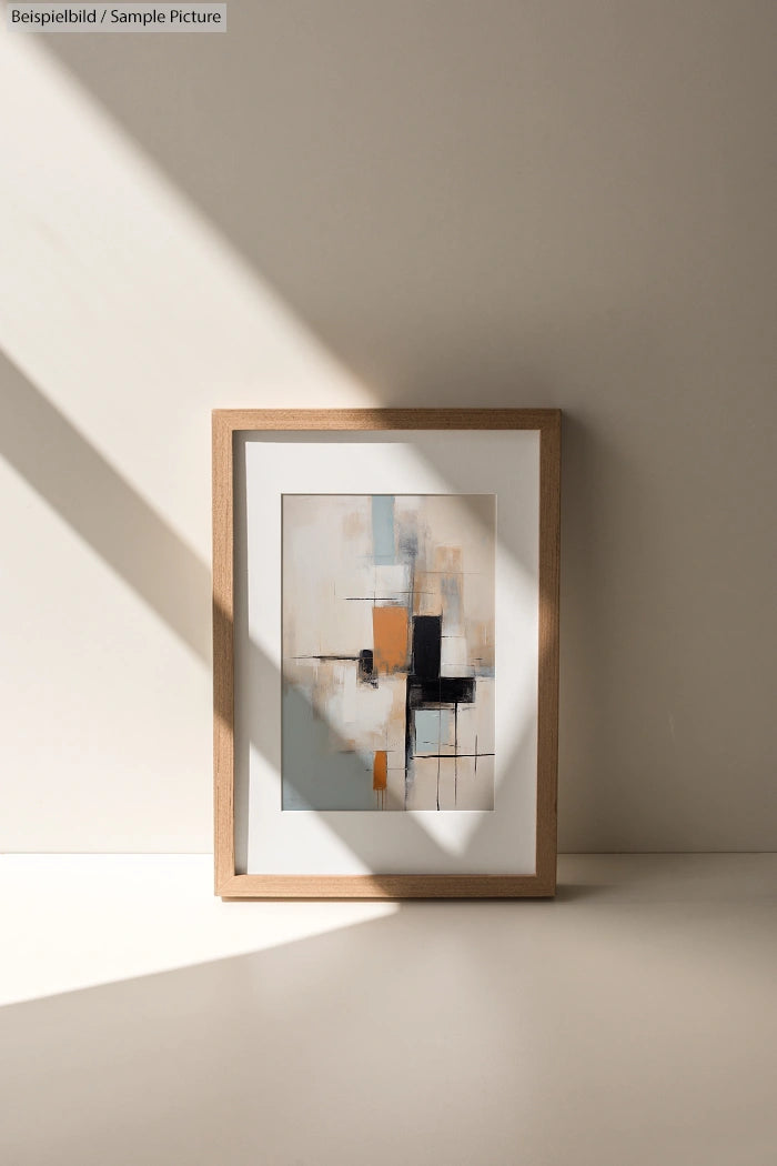 Framed abstract painting with geometric shapes casting shadows on a light background in a minimalist setting.