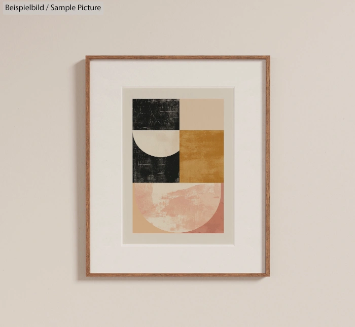 Framed abstract art print with geometric shapes in black, beige, pink, and ochre colors on a light wall.