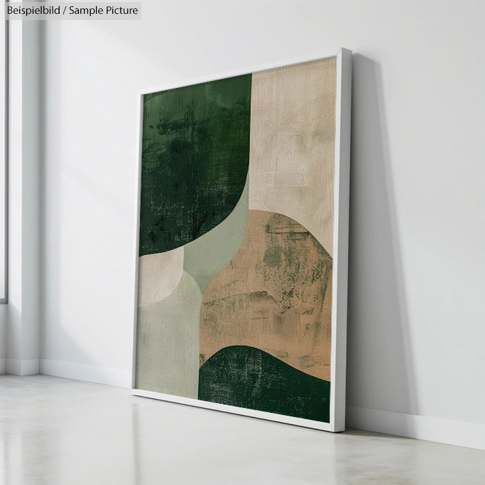 Abstract painting with geometric shapes in green and beige tones, framed and leaning against a wall.