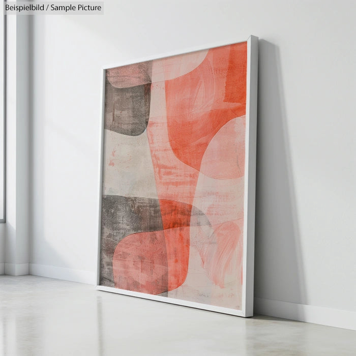 Large abstract painting with red and gray organic shapes leaning against a white wall, in a bright room with natural light.