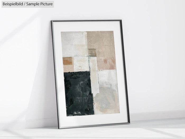 Framed abstract painting with textured blocks in muted tones, leaning against a white wall on a floor.