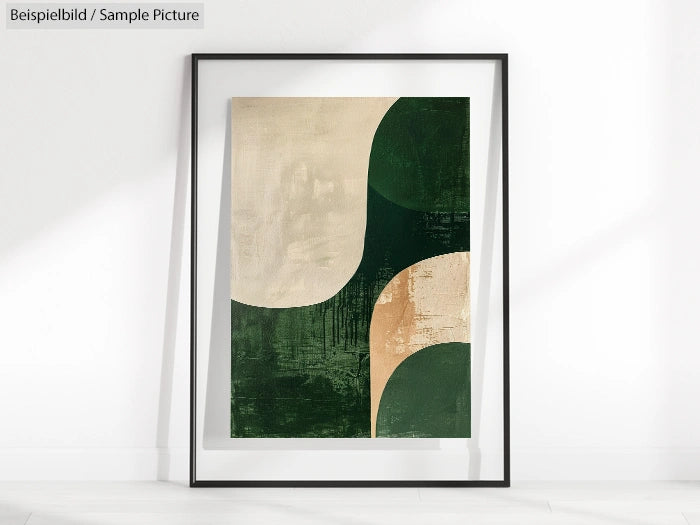 Framed abstract art print with green and beige geometric shapes on a white wall.