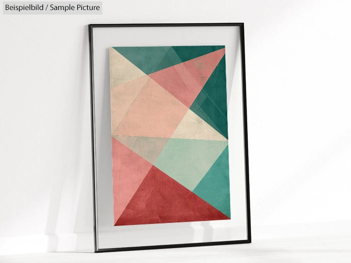 Framed abstract geometric art with intersecting triangles in pink, teal, and gray hues.