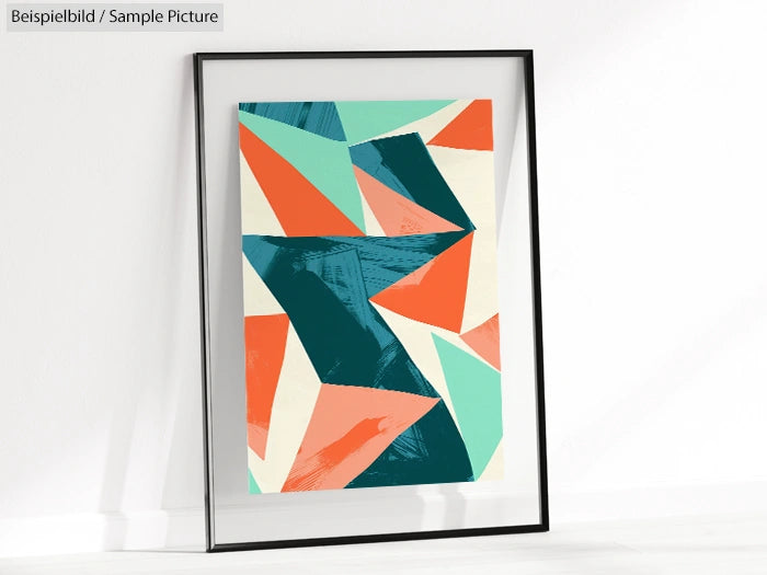 Framed abstract geometric art print with teal, orange, and cream shapes on a white wall.