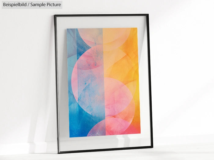 Framed abstract artwork with overlapping pastel circles in blue, pink, and yellow hues against a light background.