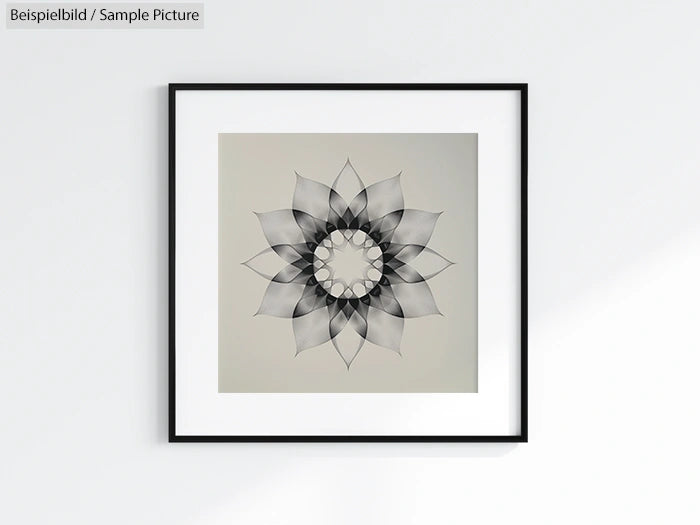 Framed artwork of symmetrical black and white geometric flower on a light background.