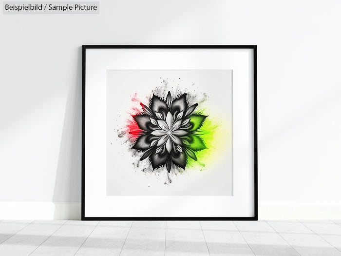 Black flower artwork with red and green highlights in a black frame on a white wall.