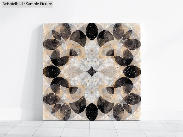 Abstract geometric artwork on canvas with circular and leaf-like patterns in black, gray, and beige tones.