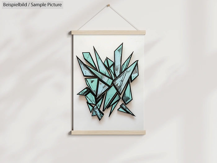 Geometric artwork with blue polygonal shapes on a white background, framed with light wood trim and hanging on a wall.