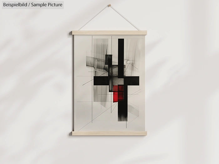 Abstract geometric painting with black and red blocks on a white hanging canvas.