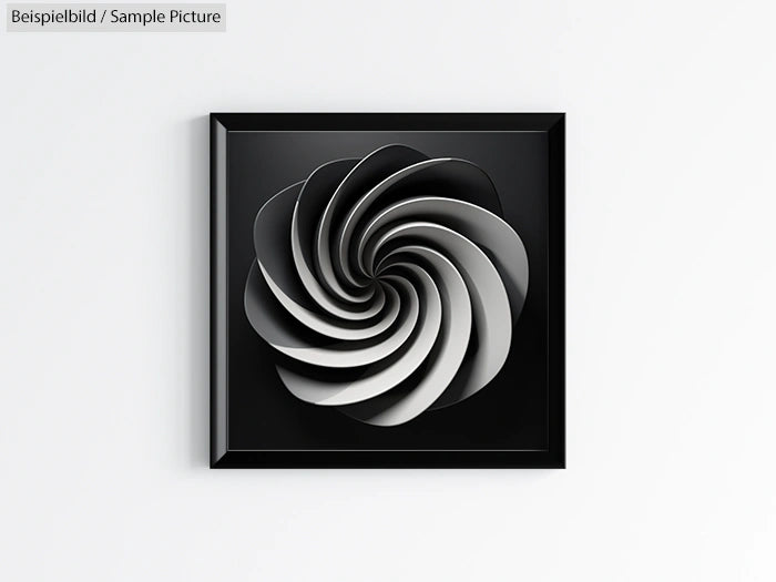 Framed abstract art with spiral design in shades of black and white on a light wall.