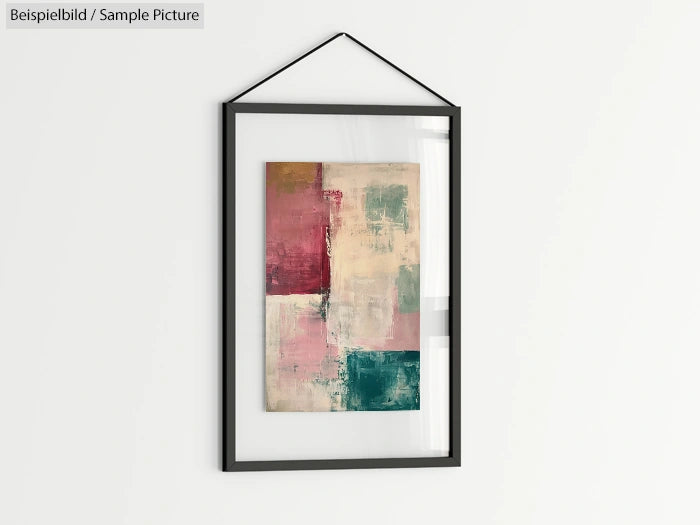 Framed abstract painting with red, pink, cream, and teal blocks, hanging on a white wall.