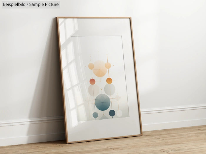 Minimalist abstract art print with geometric circles in pastel colors leaning on a white wall.