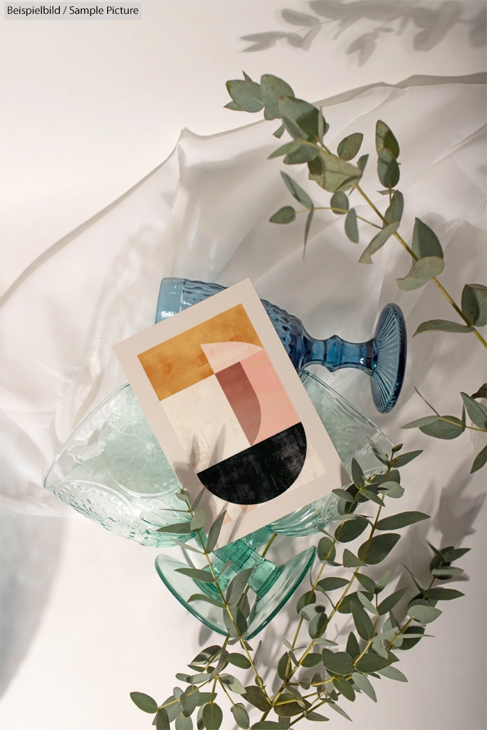 Abstract art card with geometric shapes on colored goblets and leafy branches, set against a light backdrop.