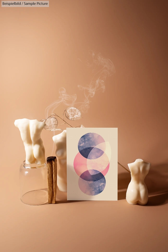 Abstract pastel circles art with scented candles shaped like torsos, on a beige background with smoke.