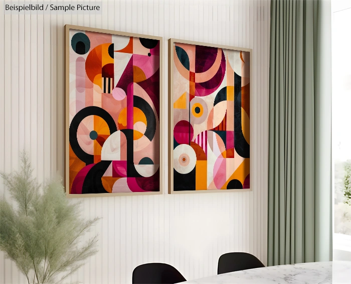 Two abstract paintings with colorful geometric shapes in a modern home interior.