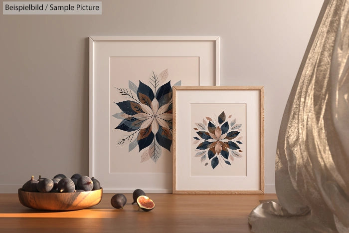 Framed floral art prints with figs in bowl, set against a neutral-toned wall.