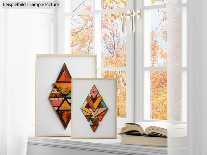 Geometric wood art on a windowsill with an autumn view outside.