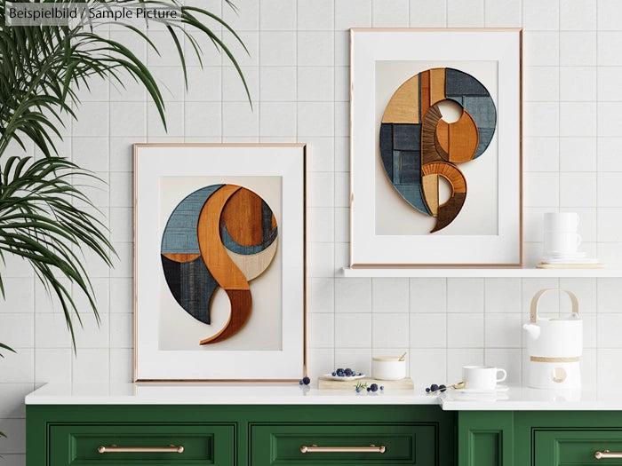 Modern kitchen with geometric wooden art on walls, green cabinetry, white countertops, potted plant, and ceramic teapot.