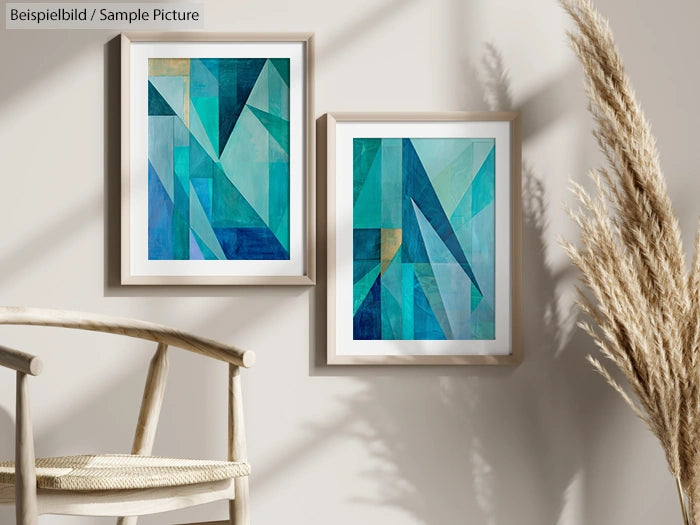 Two framed blue and green abstract geometric paintings on a beige wall with a chair and decorative grass.